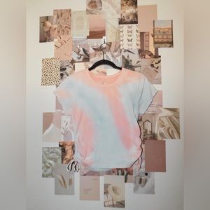 A blue and pink shirt a little bit of a crop top.The size LX and runs small